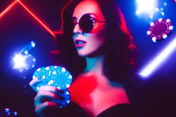 A player using their smartphone during a festive local event, representing PKTK’s fully mobile-friendly casino.